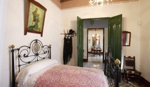 Bedroom of Federico García Lorca's parents, in the background the living room in the family home in Valderrubio.
