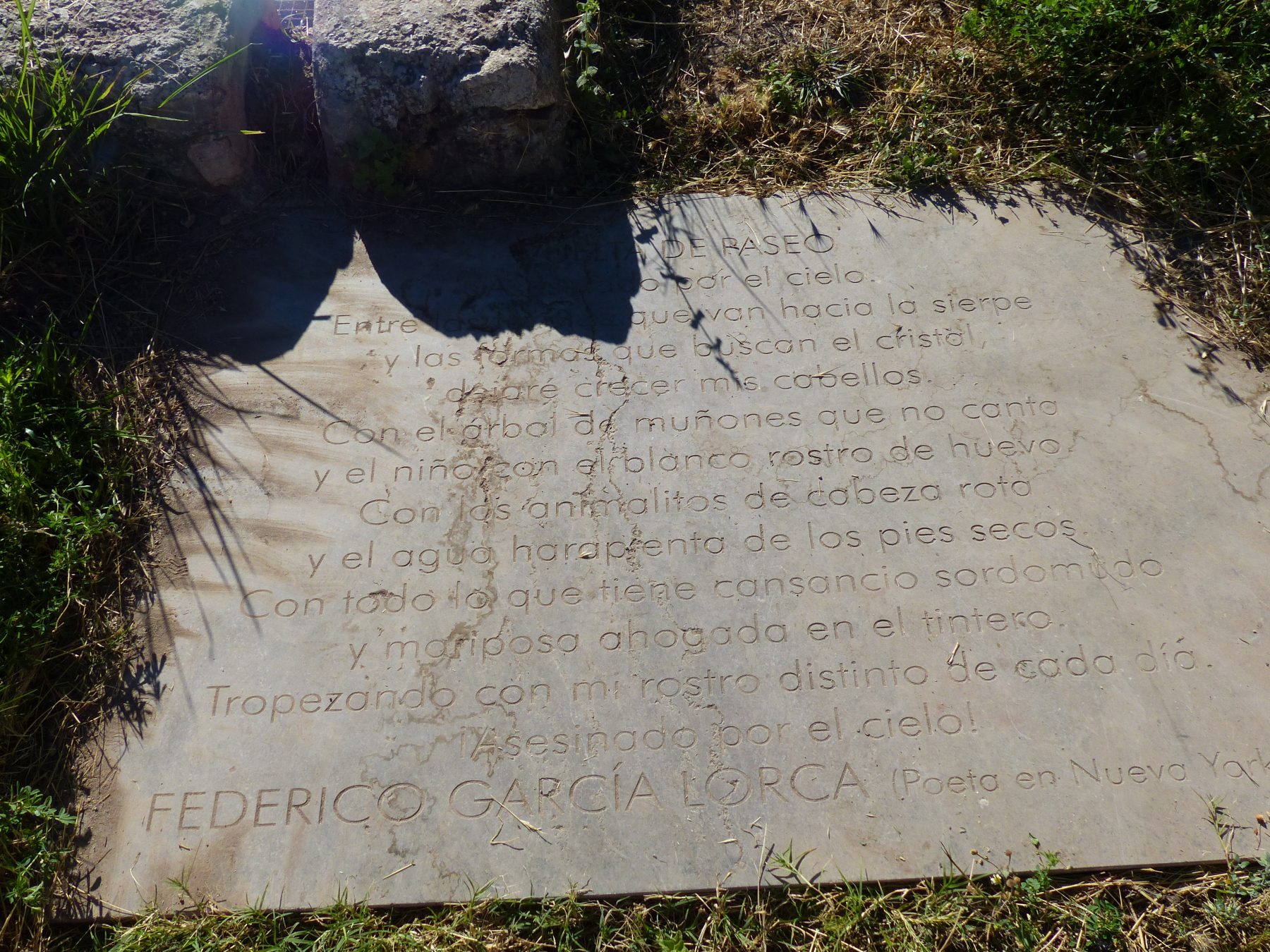 Tombstone attached to the raft of The Colony with the text of the first poem of 'Poet in New York', by Lorca.