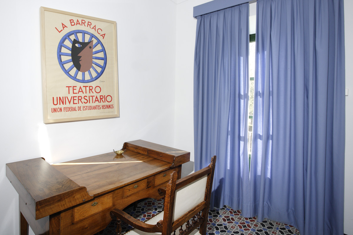 Lorca's bedroom remains the same in the Farmhouse, with the La Barraca poster above the desk.